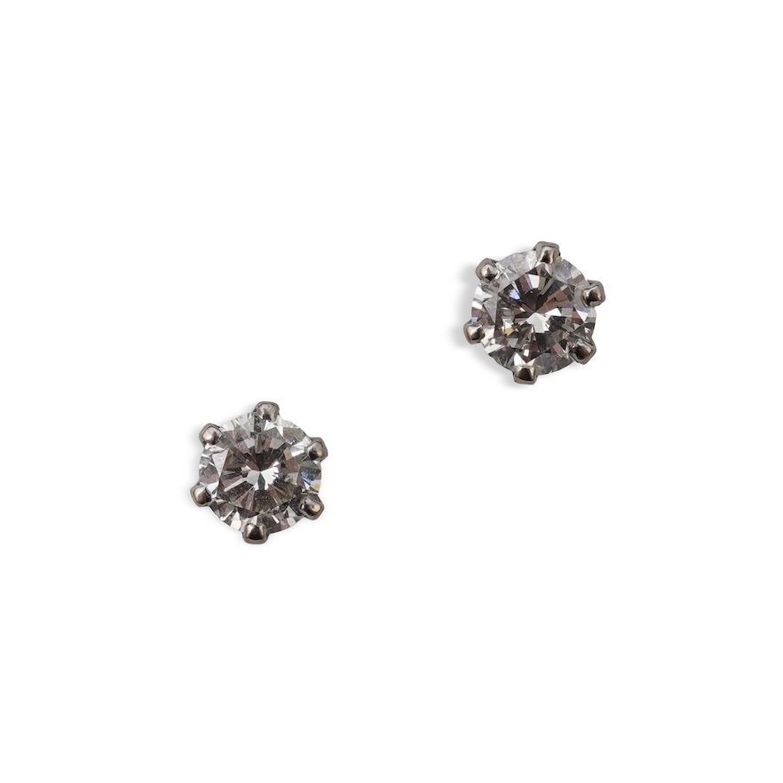 A pair of diamond stud earrings
